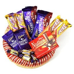 a basket full of chocolates with a variety of chocolates, 13 yummy chocolates with chocolaty delight - Expressluv.in
