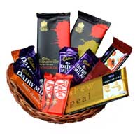 a small basket full of chocolates with 10 chocolates in the basket of different variety  - Expressluv.in