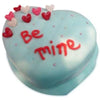 a white color heart shaped cake with some multi color hearts and red color beautiful fonts in the cake - Expressluv.in